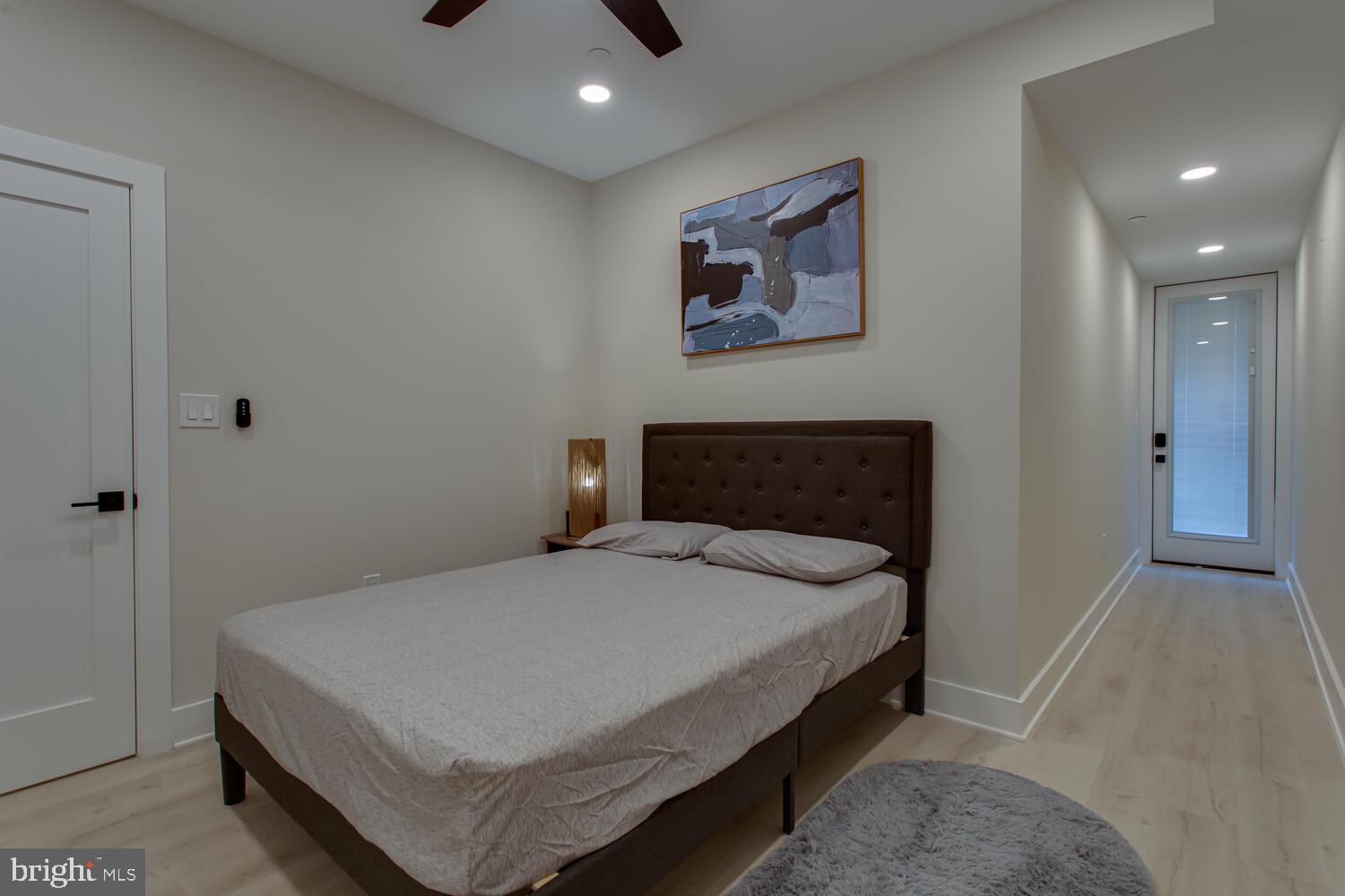 3554 13th Street Northwest, Unit 1 Washington, DC 20010 - Photo 19 of 25 a bedroom with a bed and painting on the wall