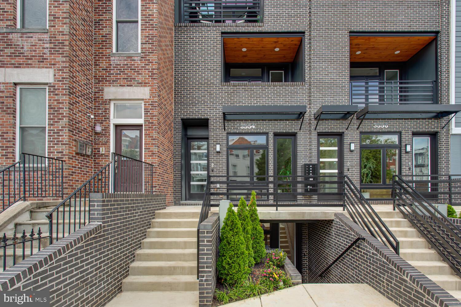 3554 13th Street Northwest, Unit 1 Washington, DC 20010 - Photo 2 of 25 a front view of a house with a porch