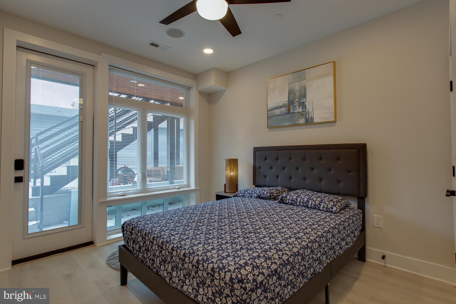 3554 13th Street Northwest, Unit 1 Washington, DC 20010 - Photo 21 of 25 a bedroom with a large bed and a large window