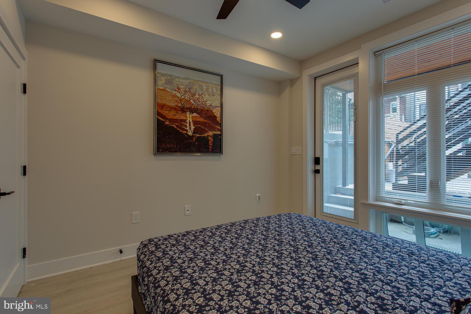 3554 13th Street Northwest, Unit 1 Washington, DC 20010 - Photo 24 of 25 a bedroom with a bed and a window
