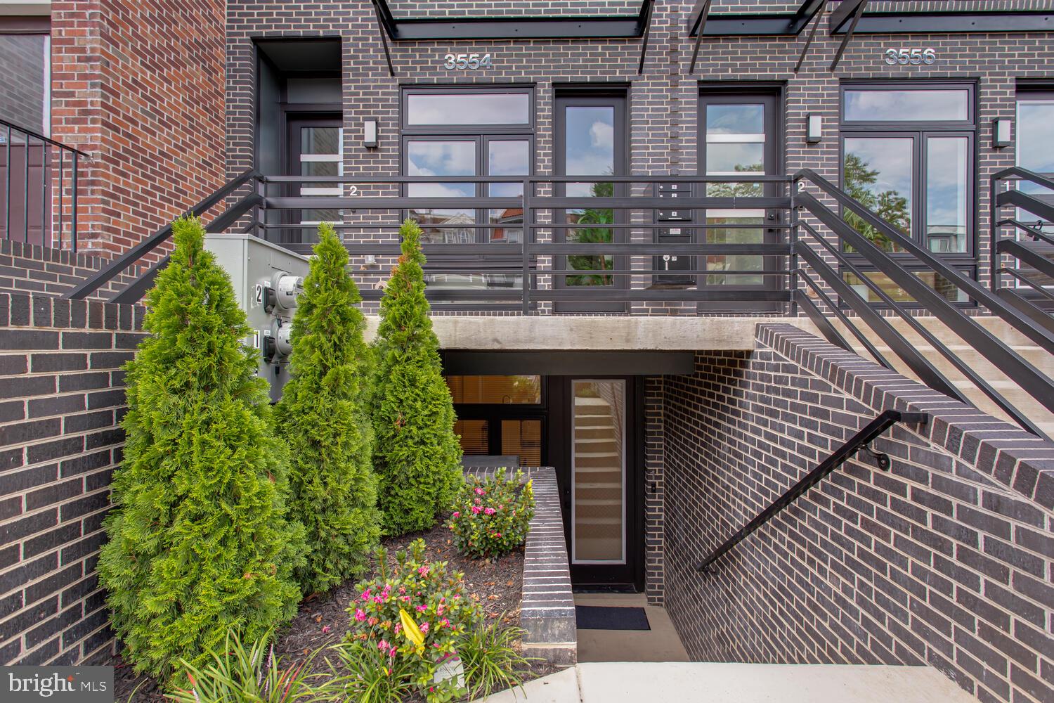 3554 13th Street Northwest, Unit 1 Washington, DC 20010 - Photo 3 of 25 a picture of a brick house with large windows