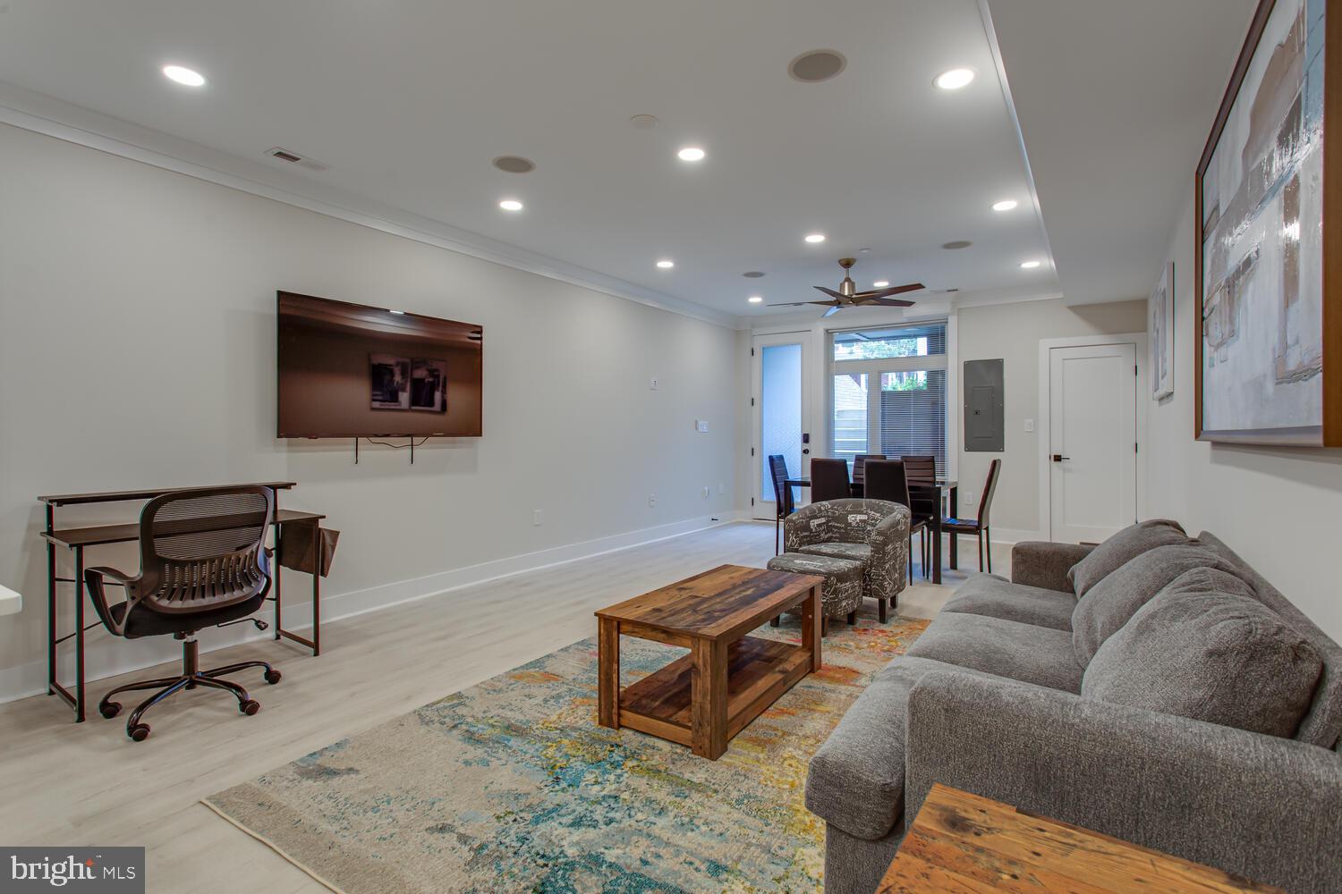 3554 13th Street Northwest, Unit 1 Washington, DC 20010 - Photo 6 of 25 a living room with furniture and a flat screen tv