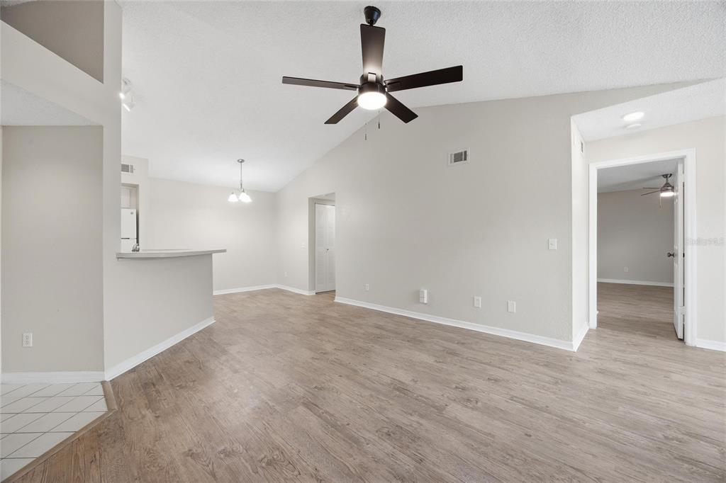 4532 Commander Drive, Unit 2132 Orlando, FL 32822 - Photo 11 of 26 a view of a livingroom with a ceiling fan