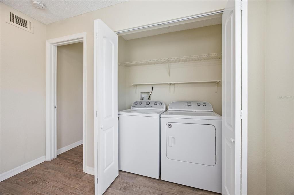 4532 Commander Drive, Unit 2132 Orlando, FL 32822 - Photo 13 of 26 a utility room with dryer and washer