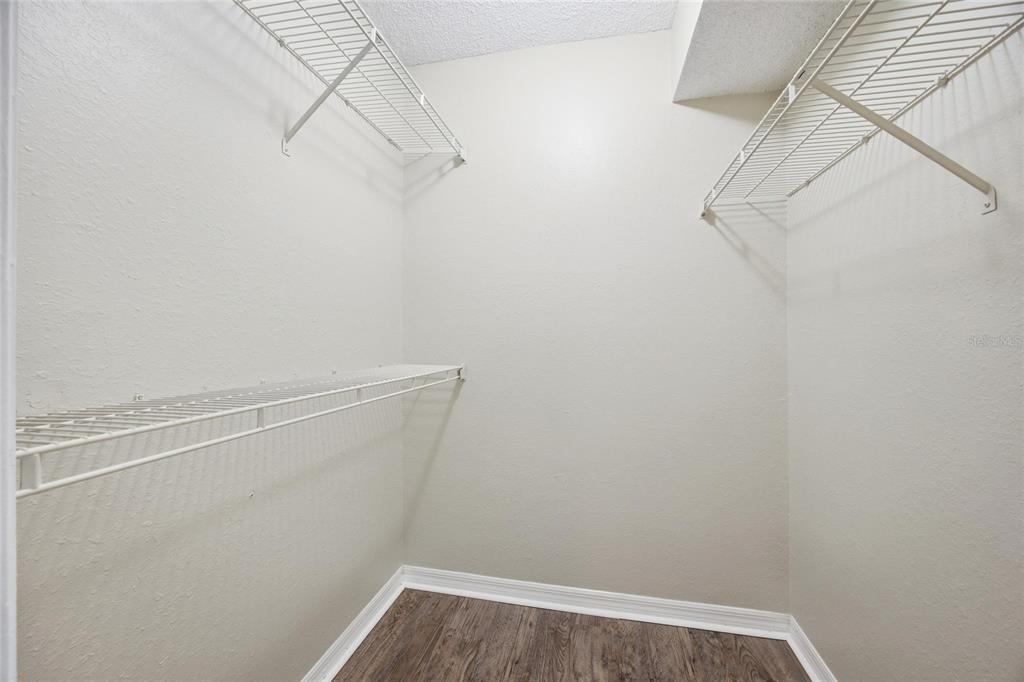 4532 Commander Drive, Unit 2132 Orlando, FL 32822 - Photo 18 of 26 a view of a room with racks on the wall