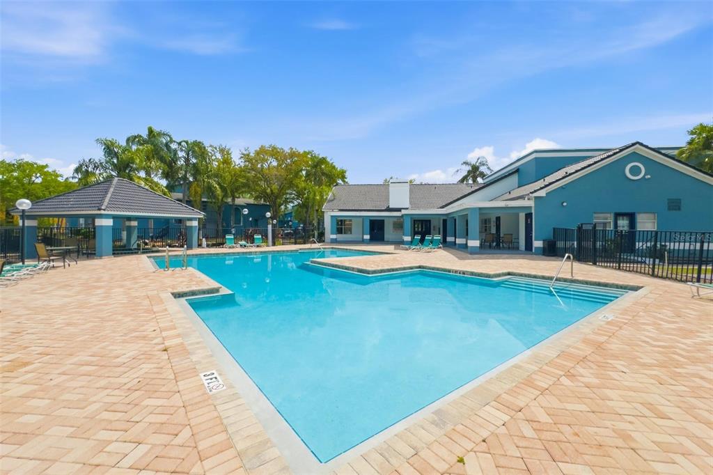 4532 Commander Drive, Unit 2132 Orlando, FL 32822 - Photo 25 of 26 swimming pool view with a seating space and a garden view