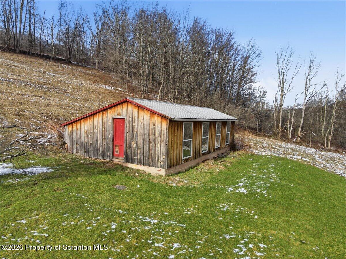 795 Wescott Road New Milford, PA 18834 - Photo 8 of 81 a view of backyard with small cabin