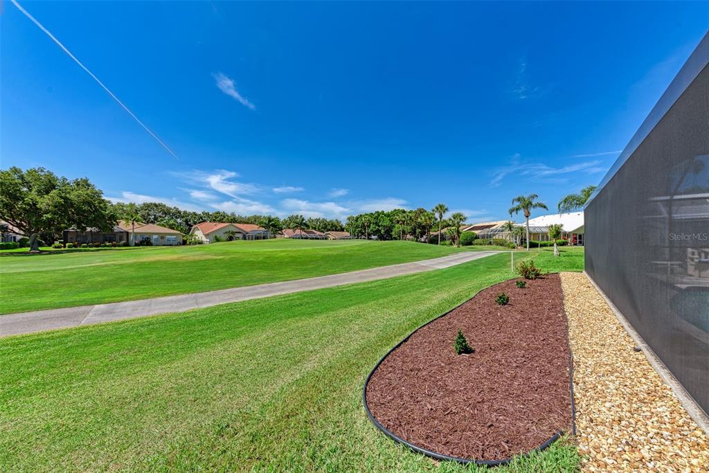 6501 Stone River Road, Unit 303 Bradenton, FL 34203 - Photo 29 of 30 a view of a golf course with a garden