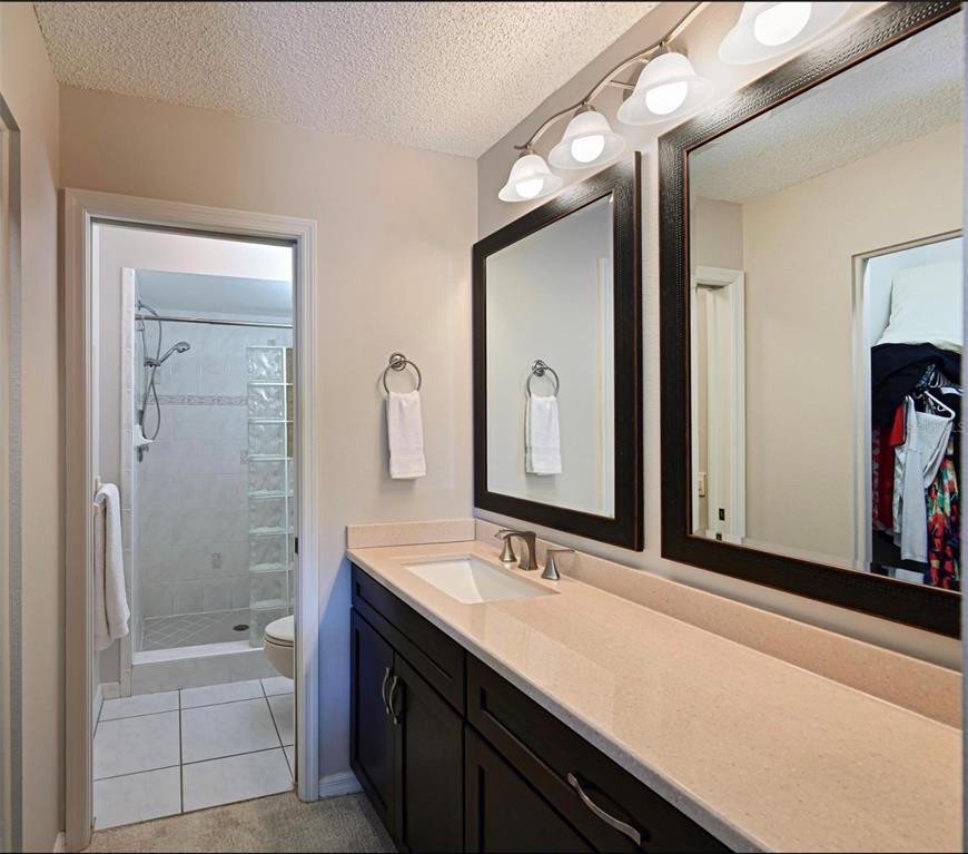 6501 Stone River Road, Unit 303 Bradenton, FL 34203 - Photo 8 of 30 a bathroom with a tub a sink and mirror
