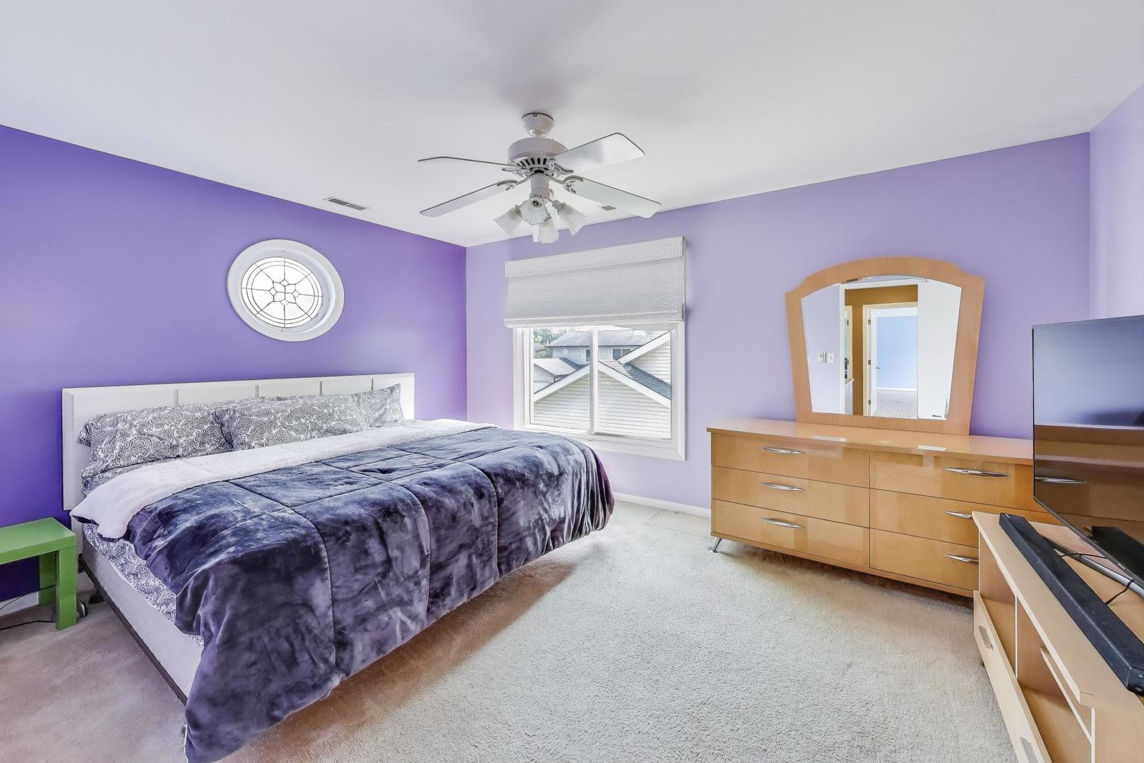5370 Sequoia Court Gurnee, IL 60031 - Photo 11 of 29 a bedroom with a bed and a dresser with mirror