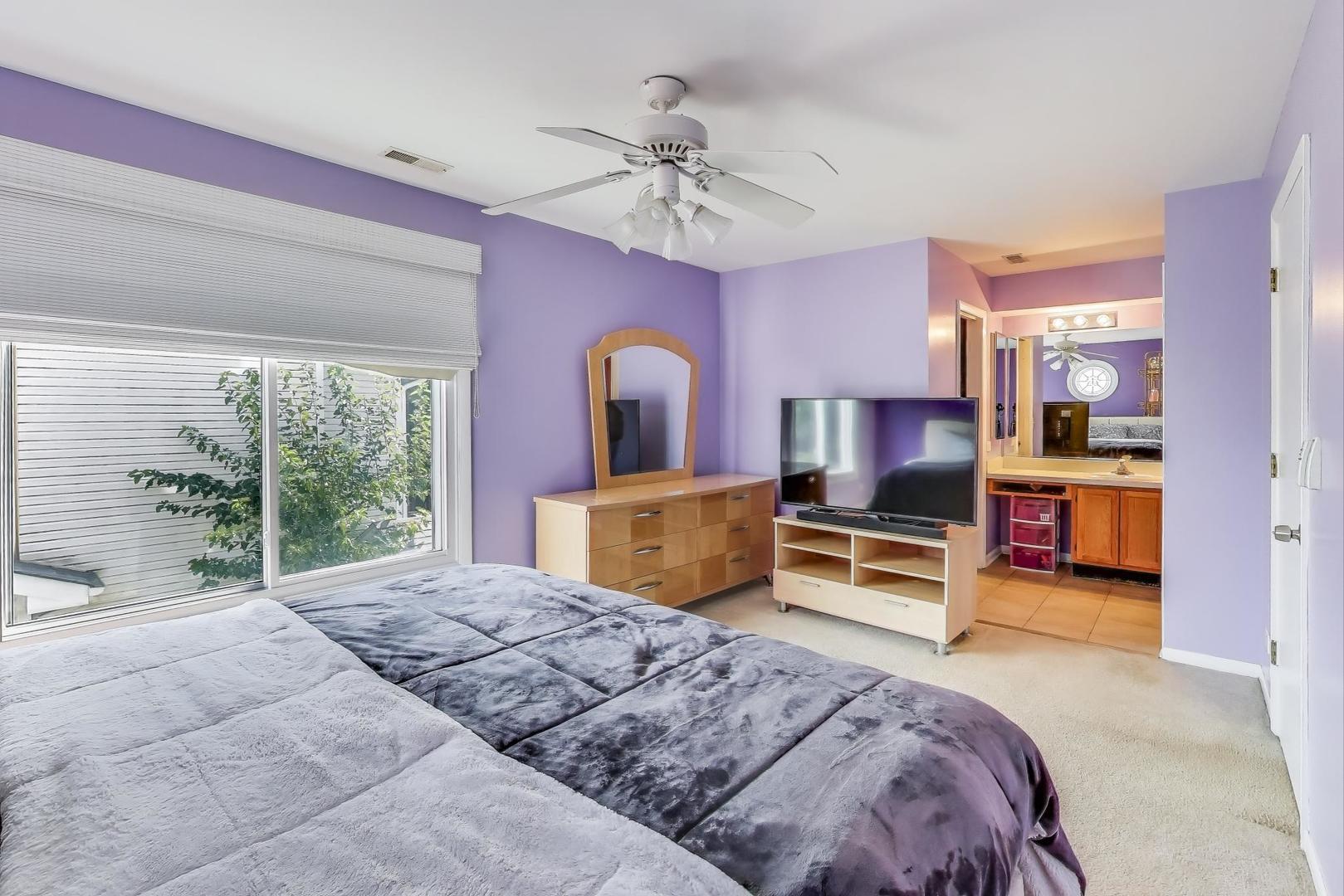 5370 Sequoia Court Gurnee, IL 60031 - Photo 12 of 29 a bedroom with a bed and a large window