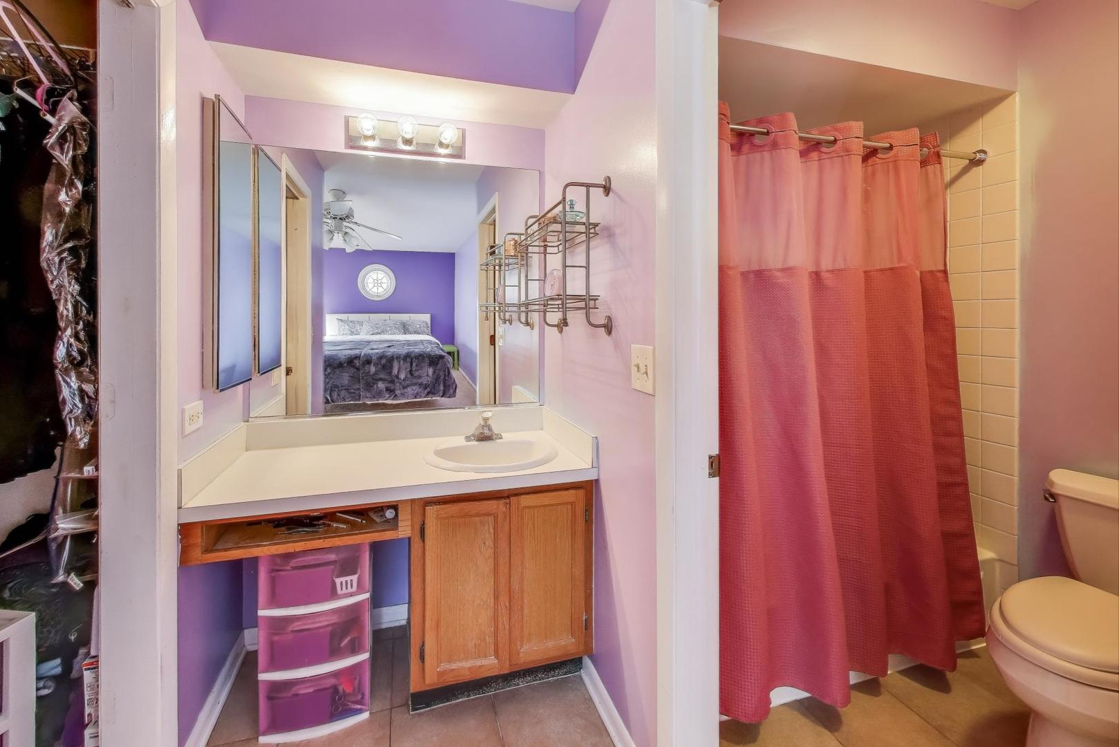 5370 Sequoia Court Gurnee, IL 60031 - Photo 13 of 29 a bathroom with a sink a toilet and shower curtain