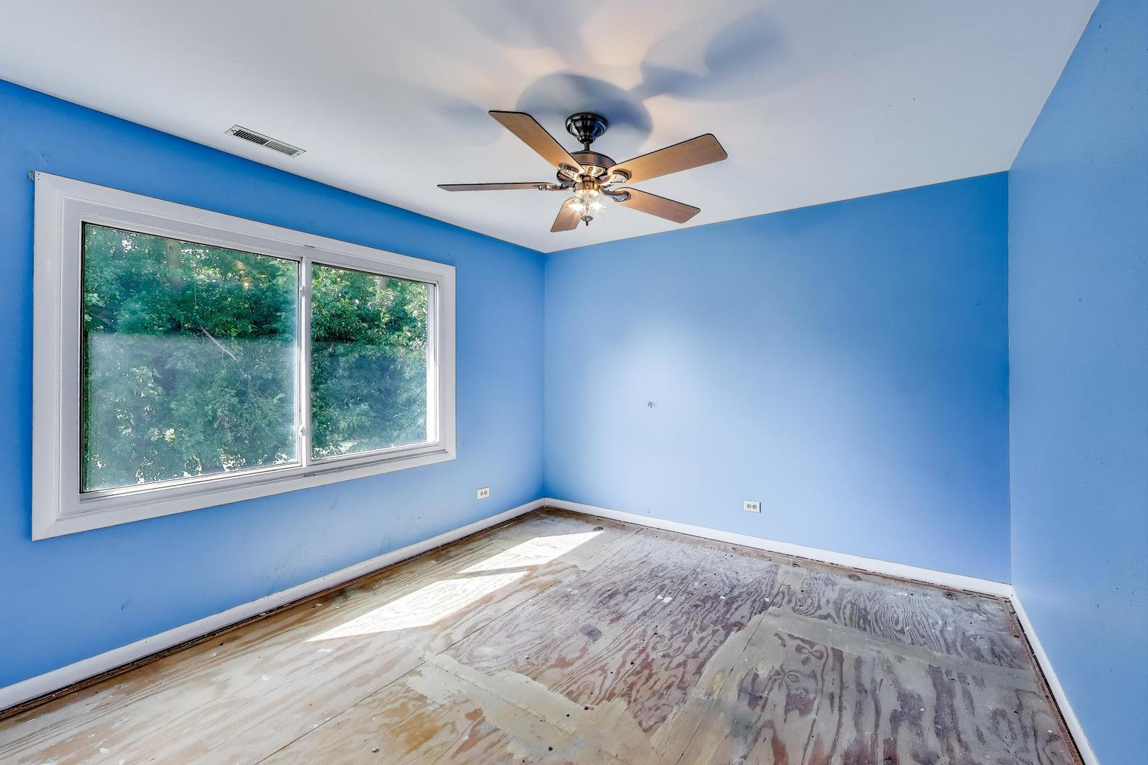 5370 Sequoia Court Gurnee, IL 60031 - Photo 15 of 29 an empty room with a window and a ceiling fan