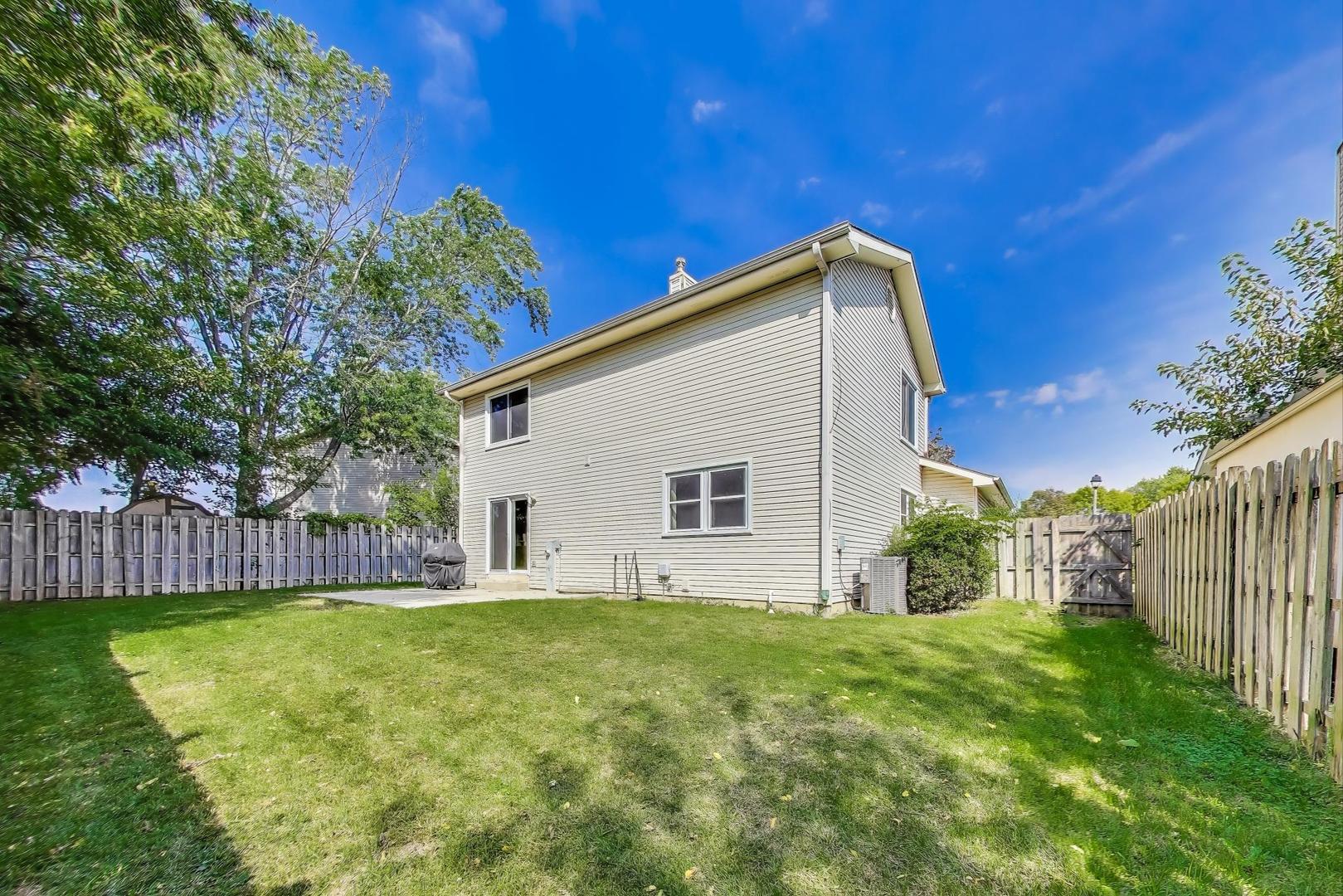 5370 Sequoia Court Gurnee, IL 60031 - Photo 25 of 29 a backyard of a house with lots of green space