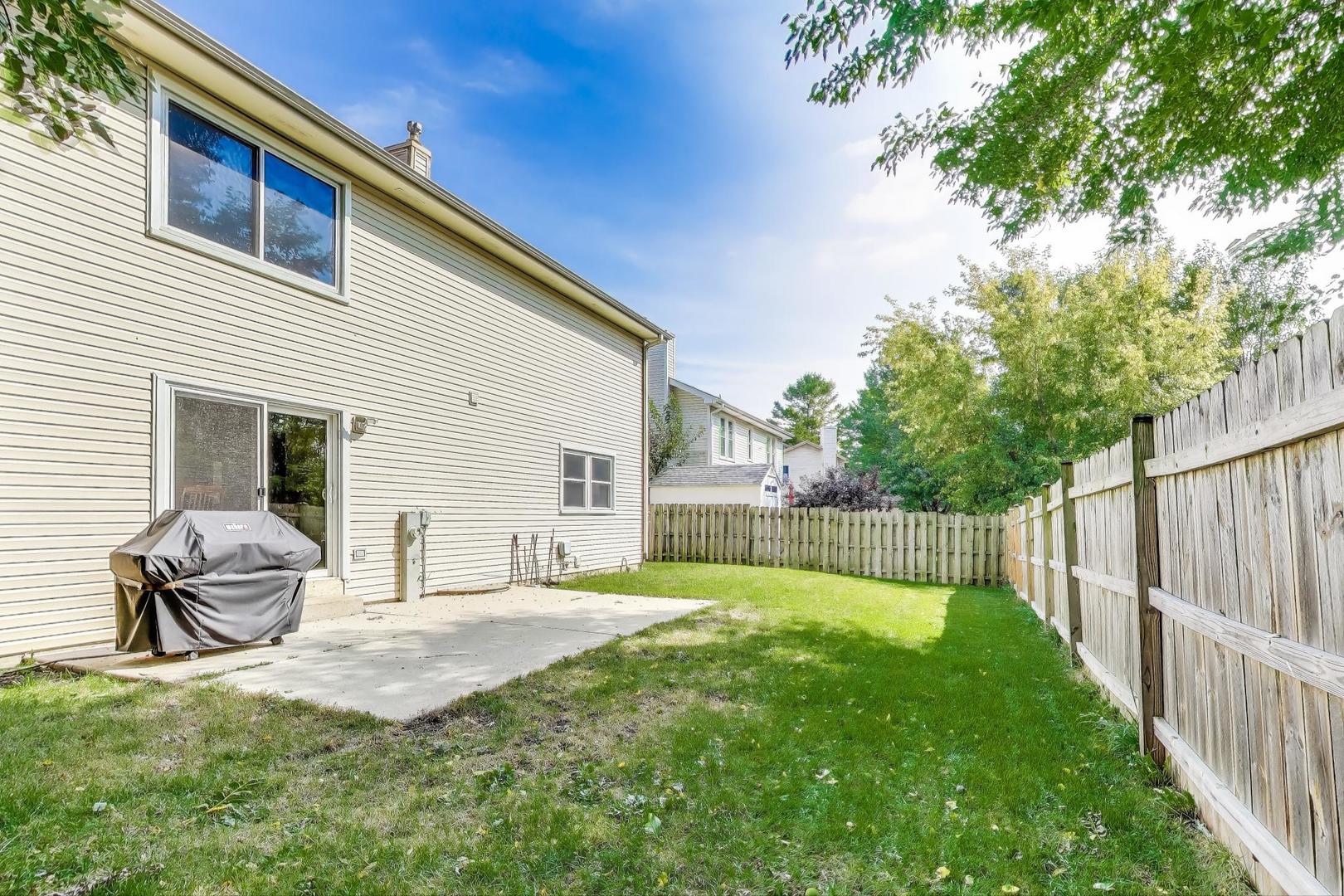 5370 Sequoia Court Gurnee, IL 60031 - Photo 26 of 29 a backyard of a house with table and chairs