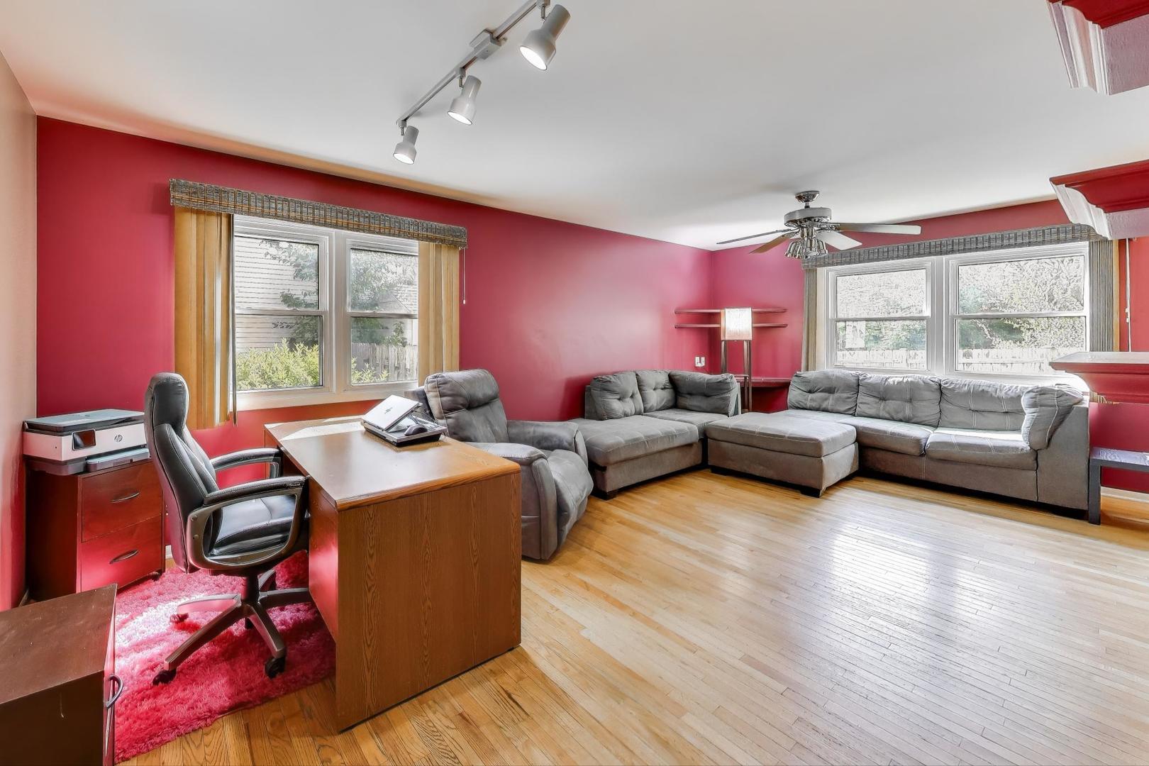 5370 Sequoia Court Gurnee, IL 60031 - Photo 5 of 29 a living room with furniture a large window and wooden floor