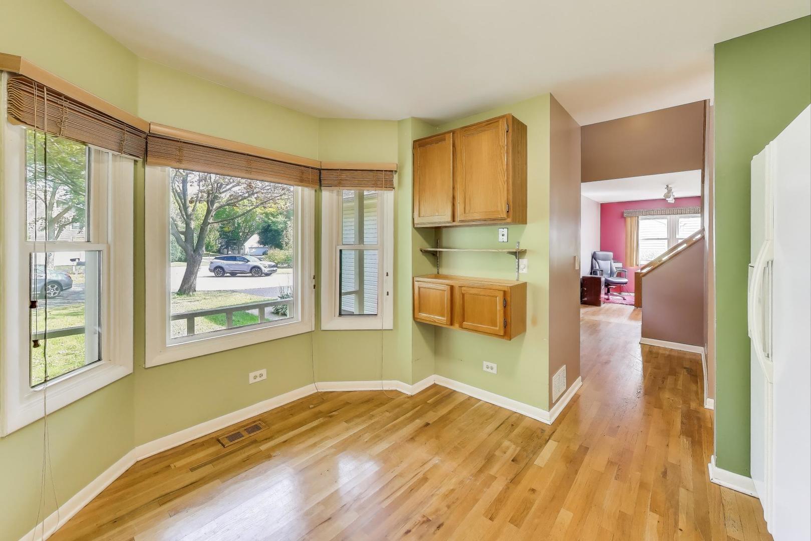 5370 Sequoia Court Gurnee, IL 60031 - Photo 8 of 29 a bedroom with a bed and wooden floor