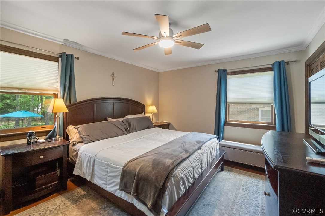 3506 Ludgate Road Chester, VA 23831 - Photo 13 of 22 a bedroom with a bed and dresser with wooden floor
