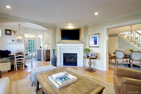 a living room with furniture fireplace and flat screen tv