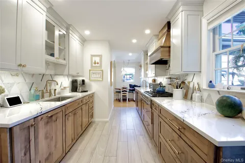 a kitchen with stainless steel appliances granite countertop a sink and cabinets