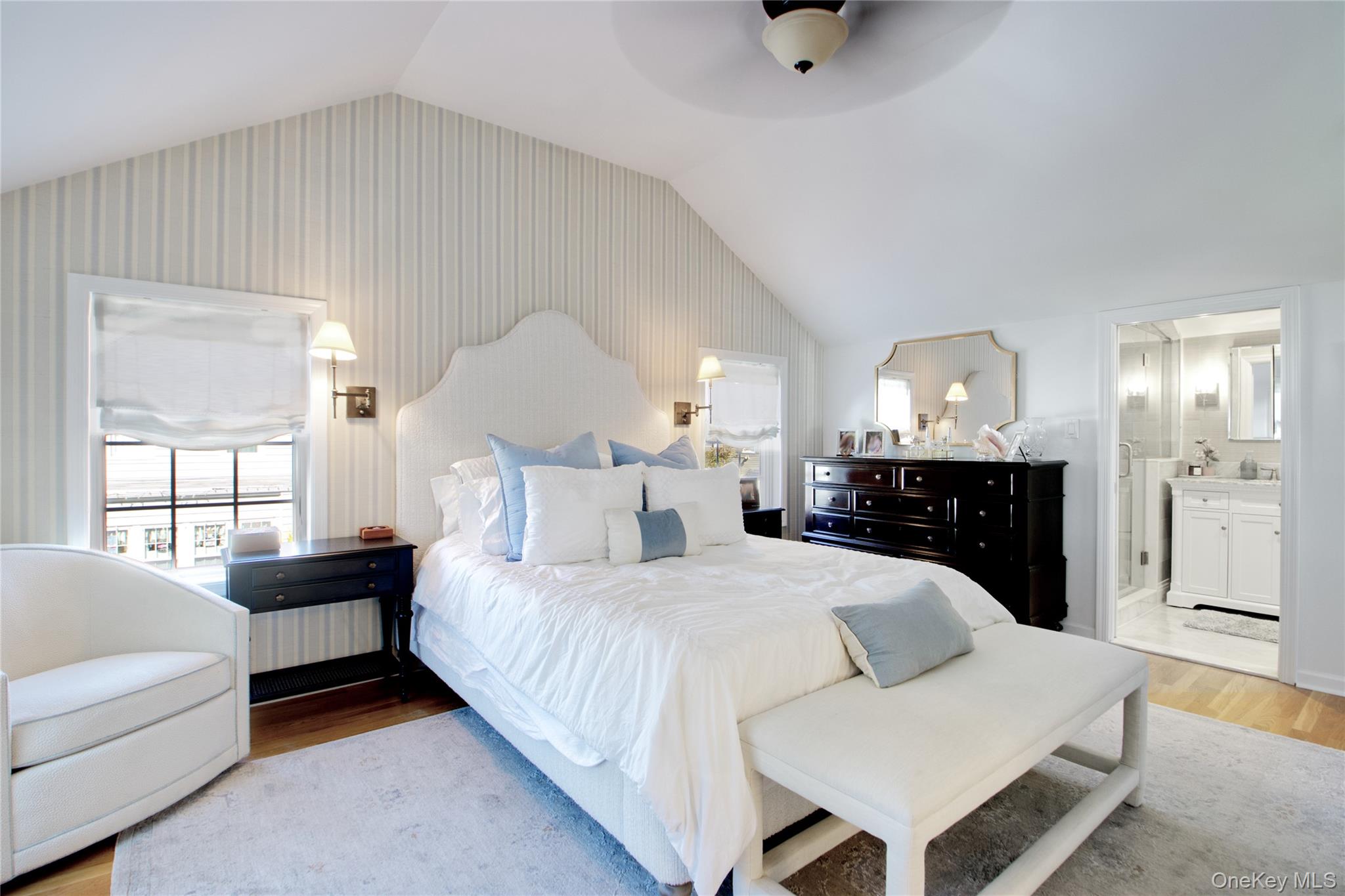 112 Bromleigh Road Garden City, NY 11530 - Photo 31 of 39 a bedroom with a bed and a chandelier