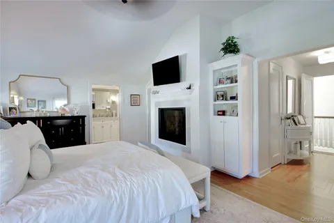 a bathroom with a sink a shower and a mirror