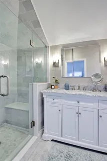 a view of a backyard with plants and chairs