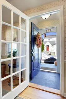 a view of room with wooden floor and a potted plant