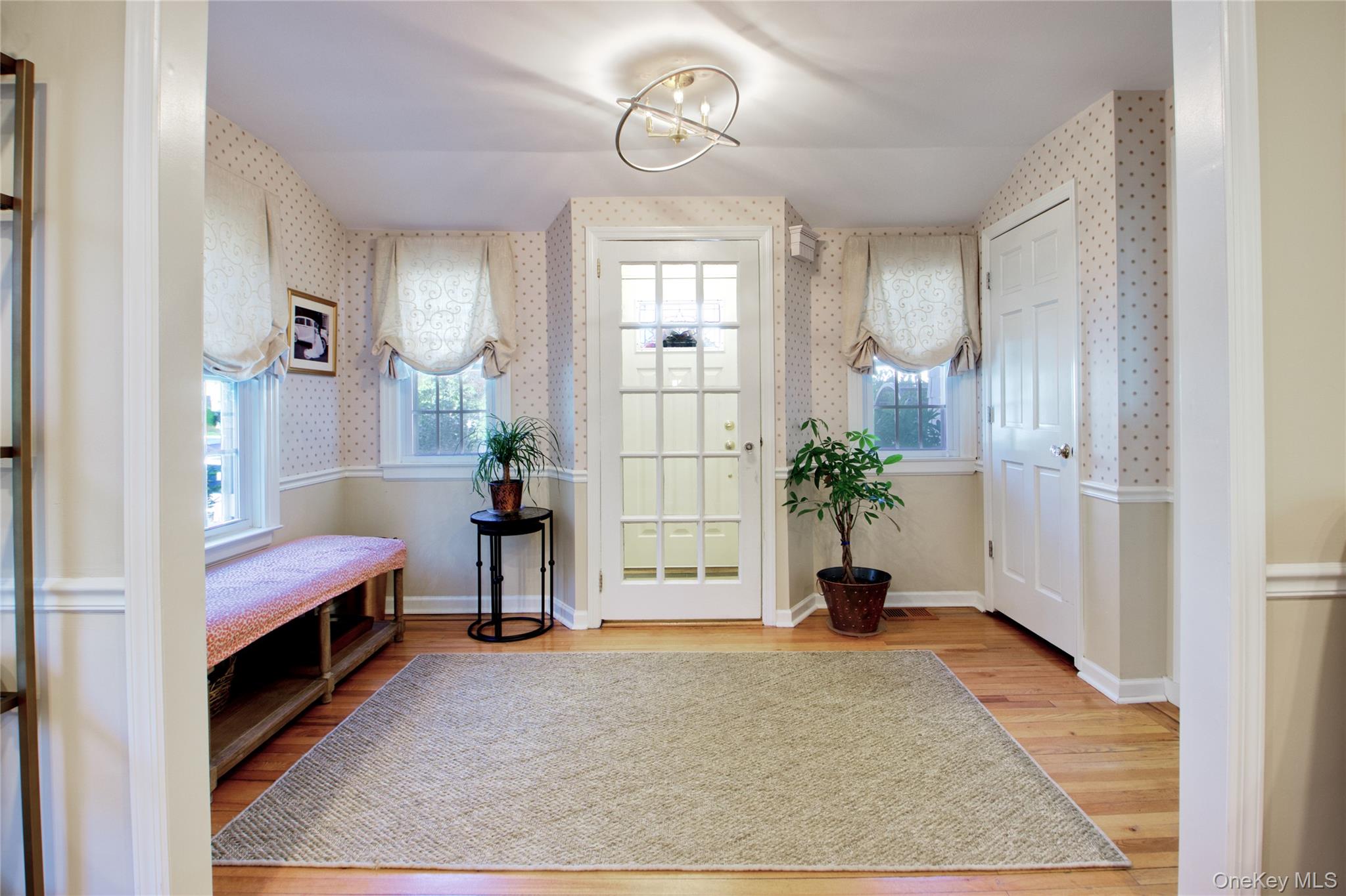 112 Bromleigh Road Garden City, NY 11530 - Photo 6 of 39 a view of room with wooden floor and a potted plant