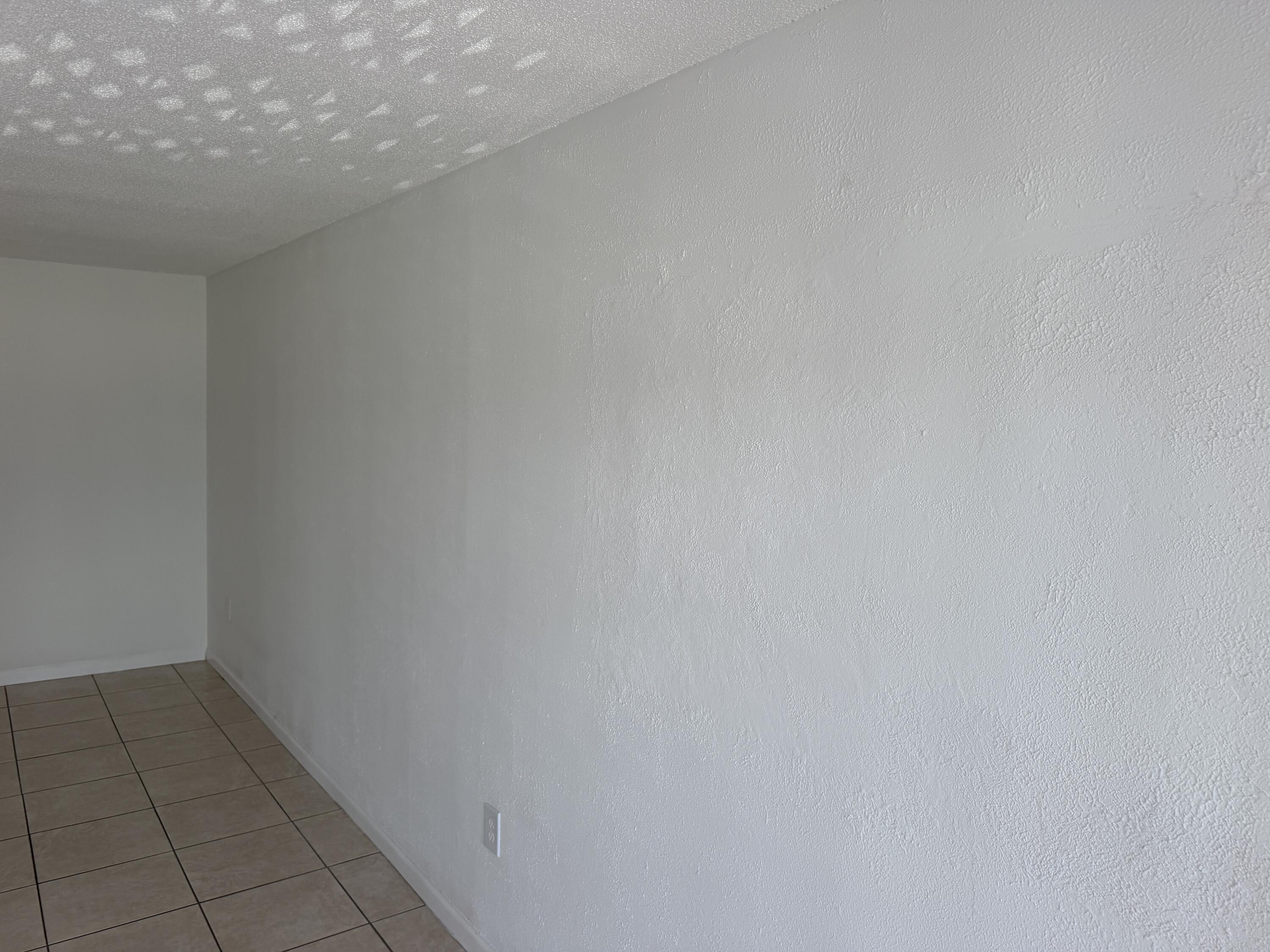 506 Davis Road, Unit 70 Palm Springs, FL 33461 - Photo 19 of 25 a view of a room with white floor and a window