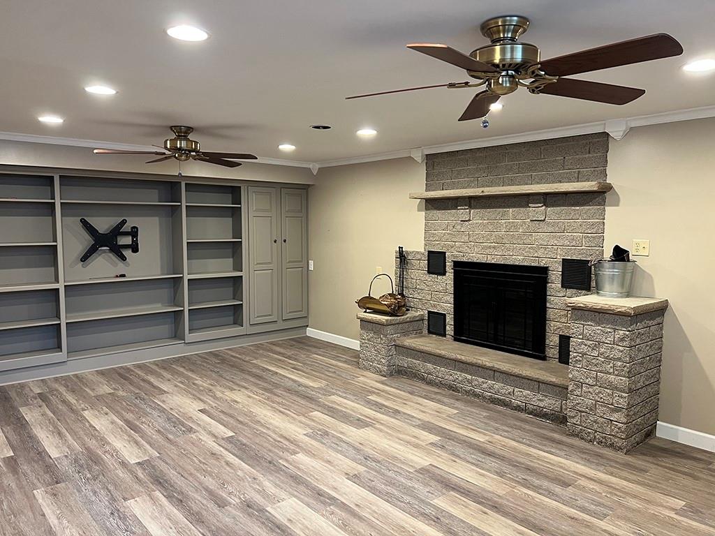 175 Jody Drive Penn Run, PA 15765 - Photo 12 of 27 a view of an empty room with a fireplace and a ceiling fan