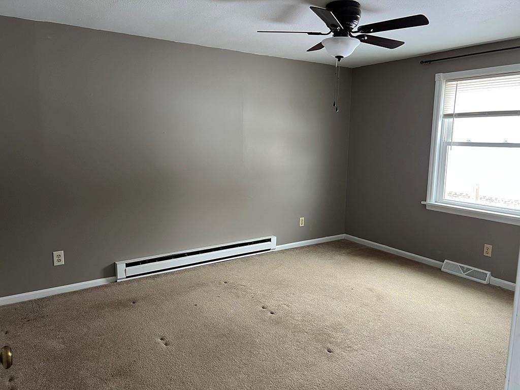 175 Jody Drive Penn Run, PA 15765 - Photo 13 of 27 an empty room with a window and a fan
