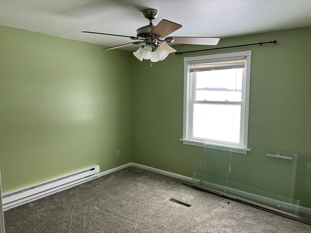 175 Jody Drive Penn Run, PA 15765 - Photo 16 of 27 an empty room with a window and a fan