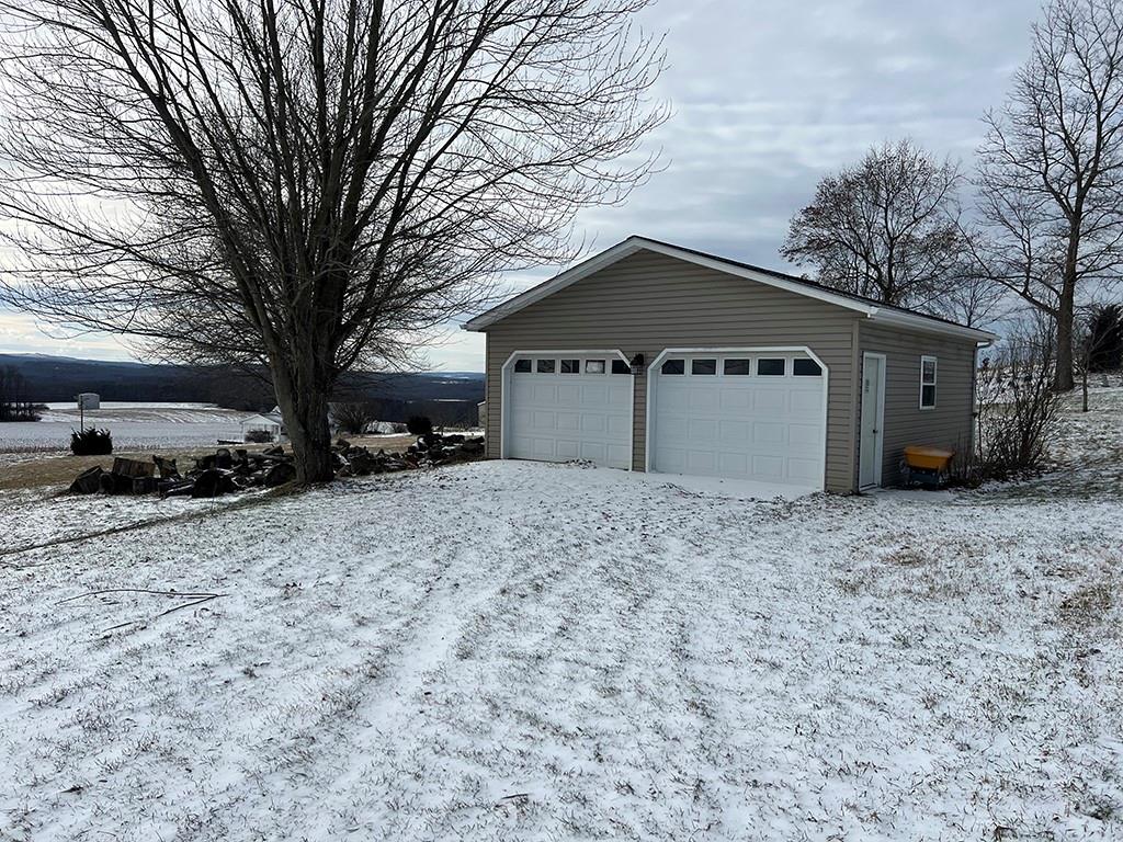 175 Jody Drive Penn Run, PA 15765 - Photo 18 of 27 a front view of a house with a yard and covered with snow