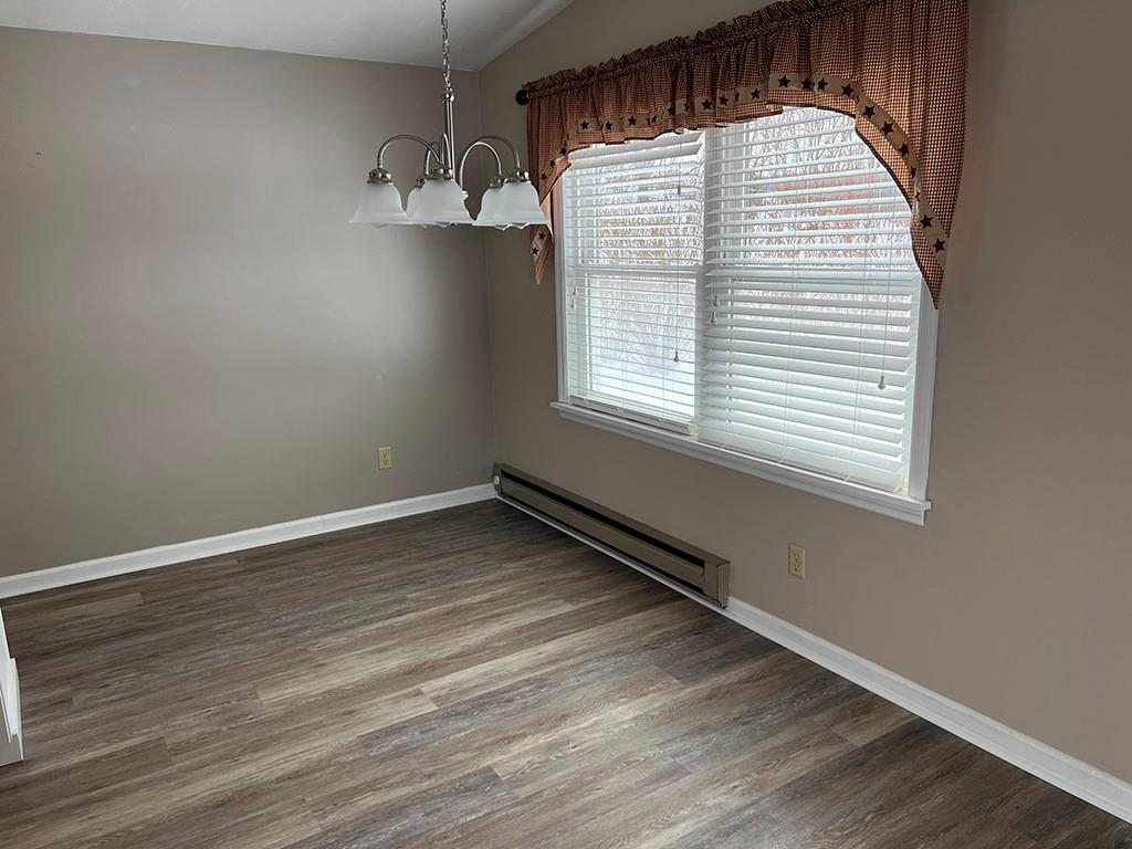 175 Jody Drive Penn Run, PA 15765 - Photo 3 of 27 an empty room with wooden floor and windows