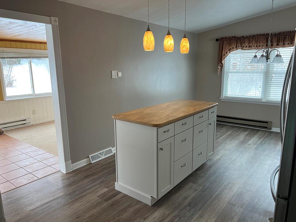 175 Jody Drive Penn Run, PA 15765 - Photo 4 of 27 a kitchen with a wooden floor and a window