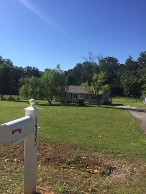 5355 Grant Road Murrayville, GA 30564 - Photo 1 of 1 a view of a golf course with a lake