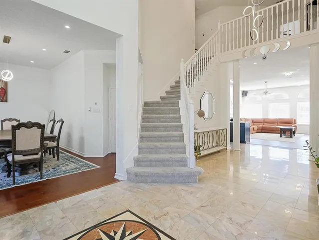 workspace with wooden floor windows and a wooden door