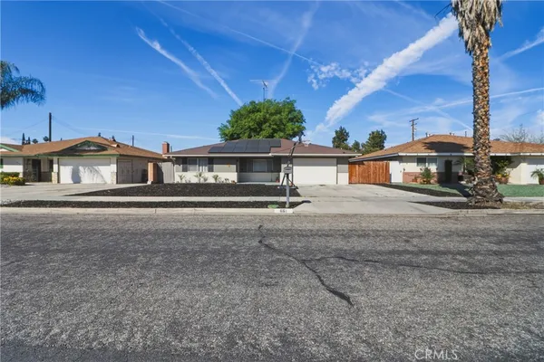 a view of a house with a street