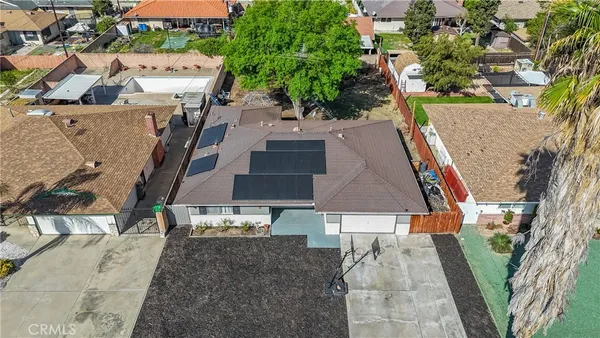 an aerial view of a house with a yard