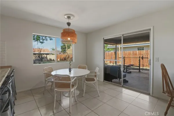 a dining room with furniture and window