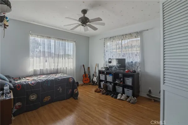 a bed room with a bed and a window
