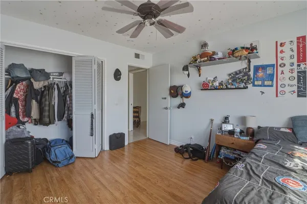 a bedroom with a bed and a walk in closet
