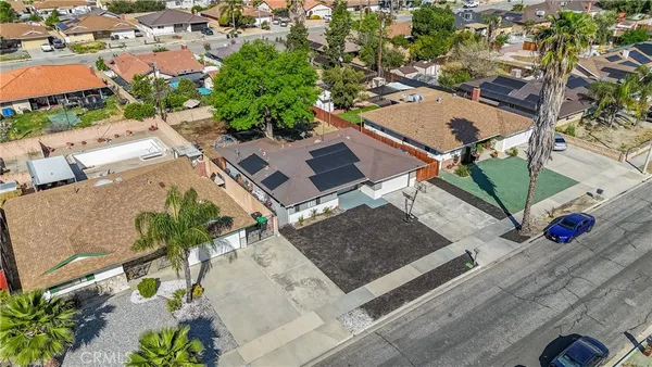 an aerial view of a house with a yard