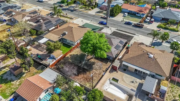 an aerial view of residential houses with outdoor space