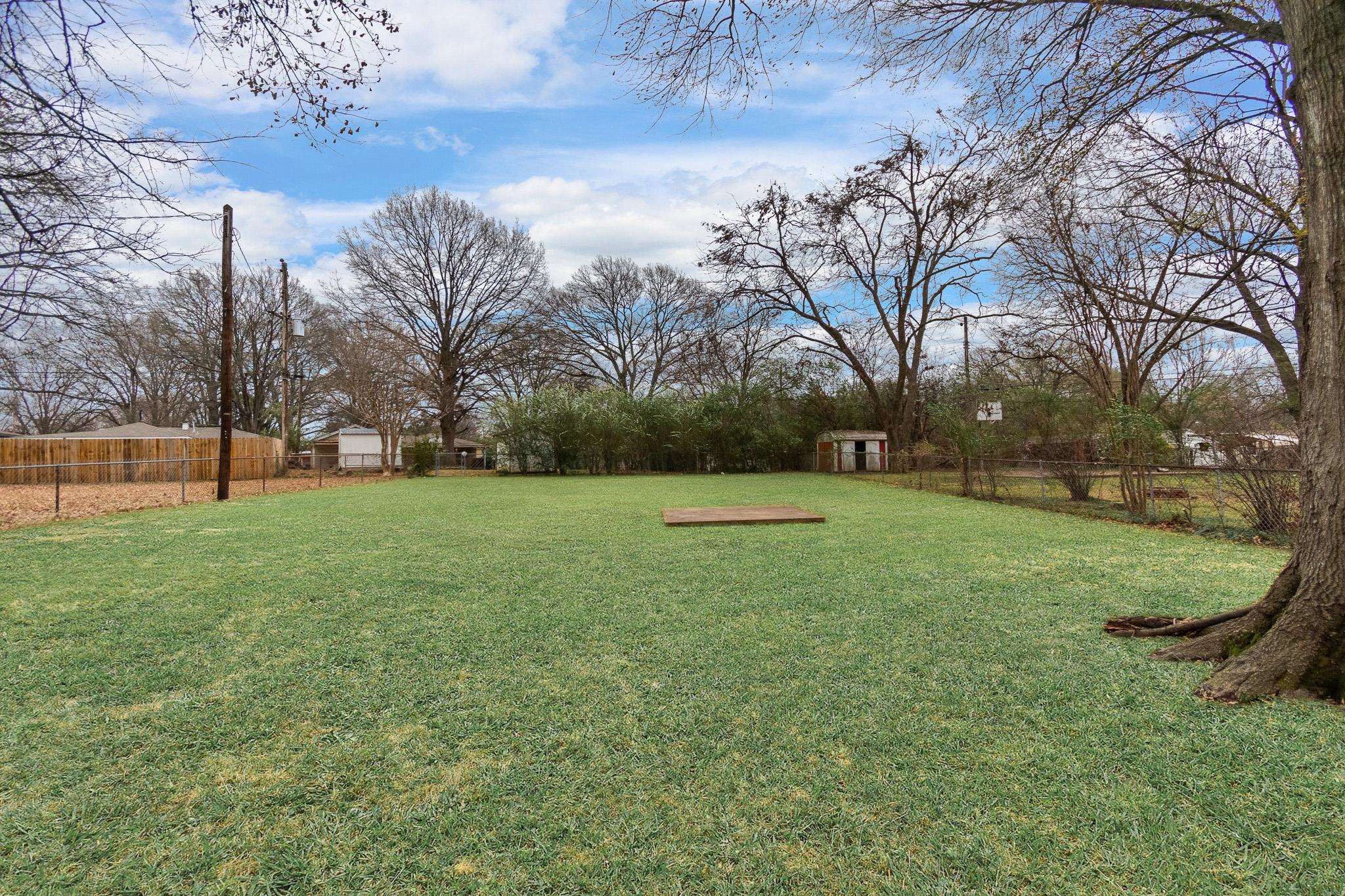 1378 Woodston Road Memphis, TN 38117 - Photo 18 of 19 a view of a garden with trees