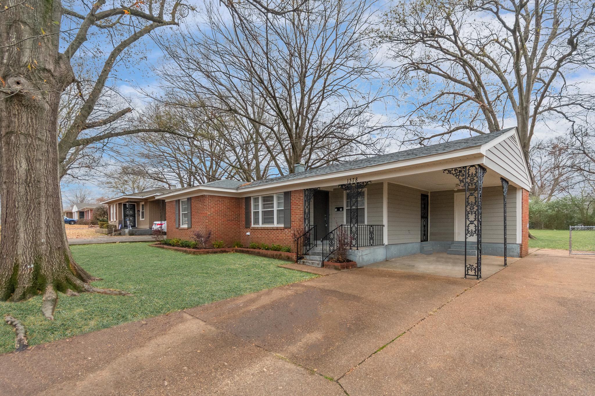 1378 Woodston Road Memphis, TN 38117 - Photo 3 of 19 a front view of house with yard and green space