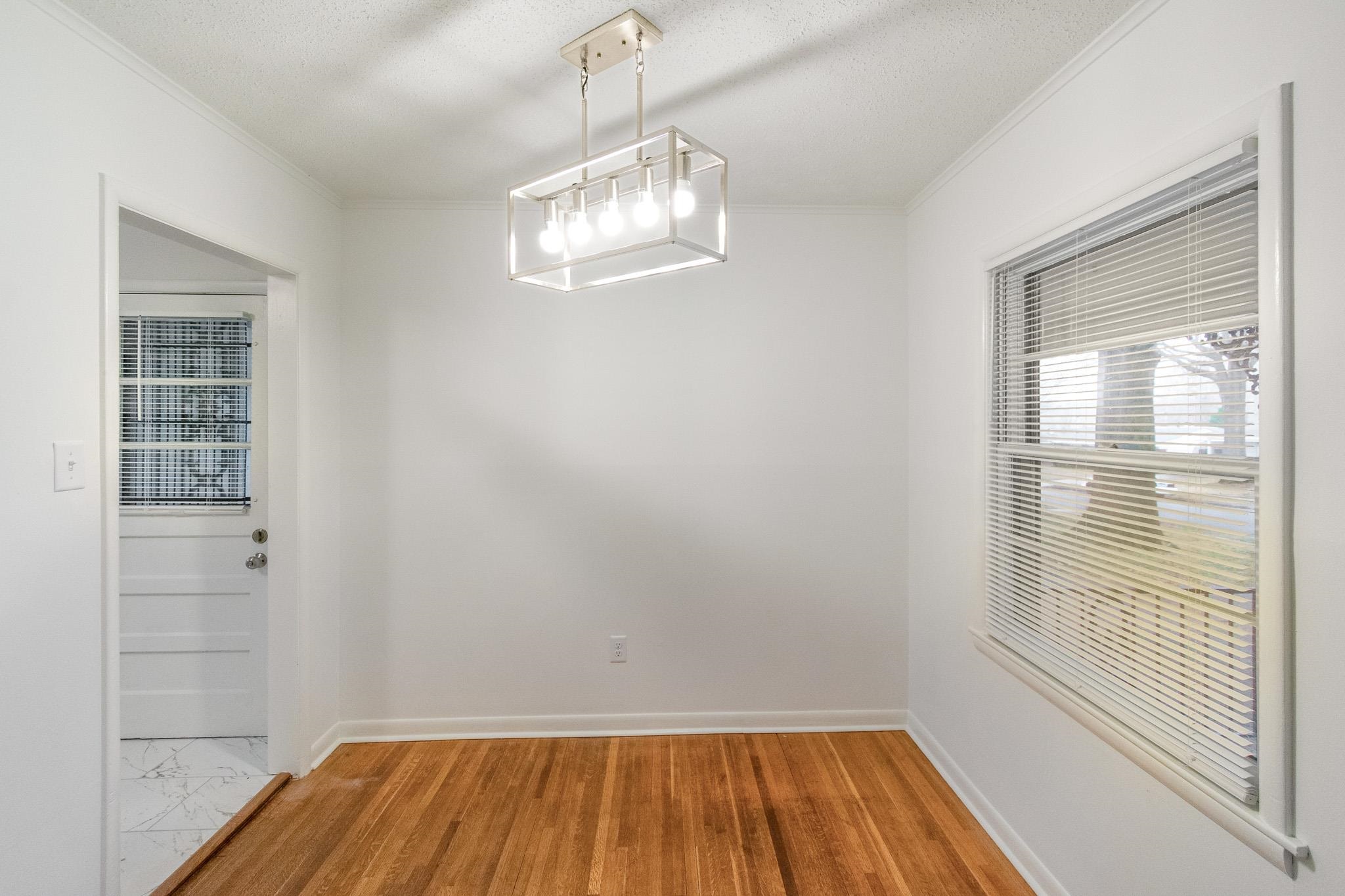 1378 Woodston Road Memphis, TN 38117 - Photo 9 of 19 a view of a room with wooden floor and windows