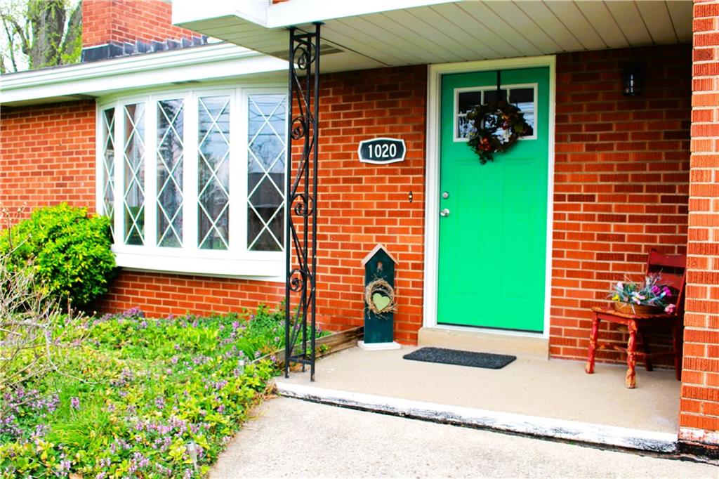 1020 Ridge Road Ambridge, PA 15003 - Photo 3 of 25 Charming front porch with colorful welcoming flowers.