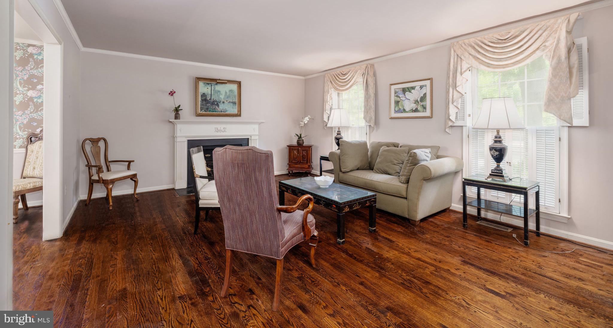 8009 Hackamore Drive Potomac, MD 20854 - Photo 3 of 19 Living room with wood-burning fireplace